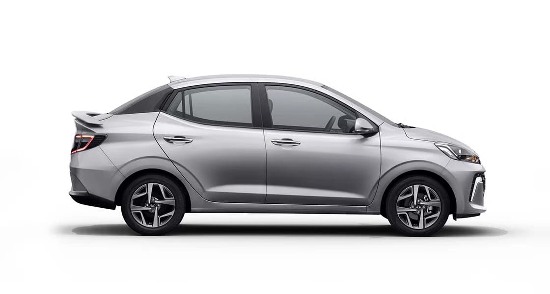 Hyundai Aura side view compact sedan designed for smooth and fuel efficient travel in city and highways