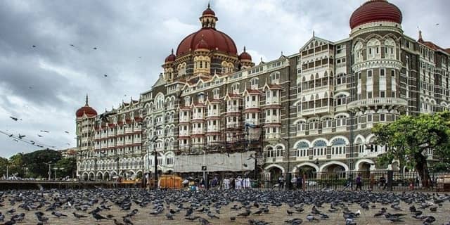 Maharashtra tourism showcasing Mumbai skyline, Ajanta Ellora Caves, hill stations, coastal landscapes, and spiritual landmarks