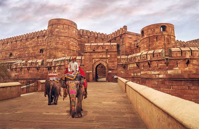 Uttar Pradesh tourism featuring Taj Mahal, Varanasi ghats, Ayodhya Ram Mandir, and heritage landmarks