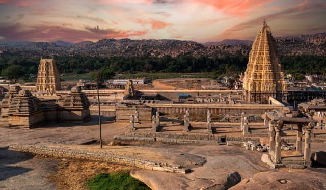 Karnataka tourism showcasing Mysuru Palace, Hampi ruins, Coorg hills, waterfalls, and heritage temples