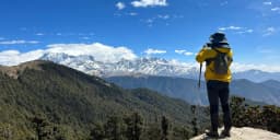 panoramic view of chopta valley with himalayan peaks during tungnath trek