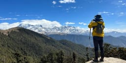 panoramic view of chopta valley with himalayan peaks during tungnath trek