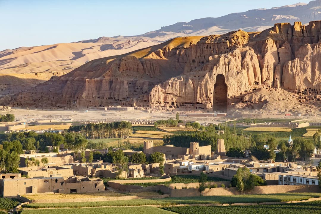 Historic cliffside caves and traditional village homes in Bamiyan, Afghanistan