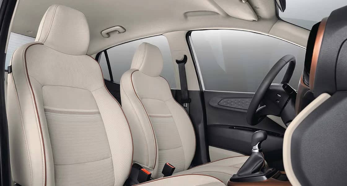 Hyundai Aura dashboard view with touchscreen infotainment system and modern sedan interior design
