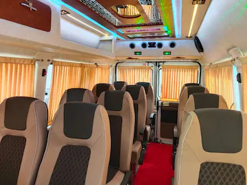 Force Tempo Traveller interior side view showing spacious seating arrangement for group travel