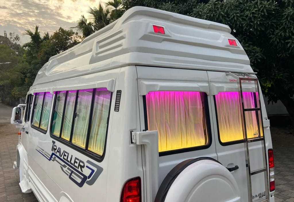 Force Tempo Traveller back side view showing spacious group travel van with luggage access and rear design