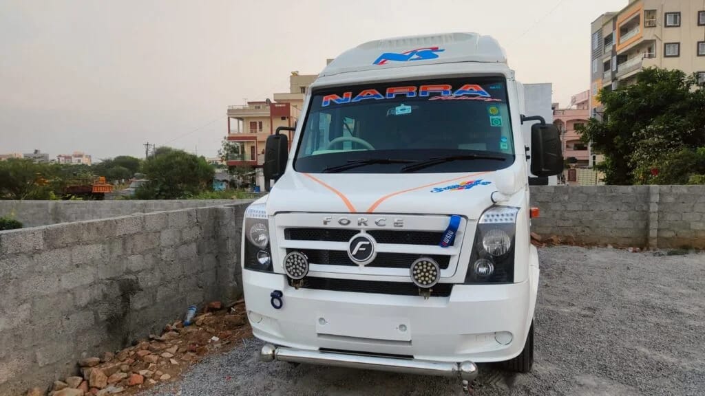 Force Tempo Traveller front side view showing luxury group travel van with bold exterior design