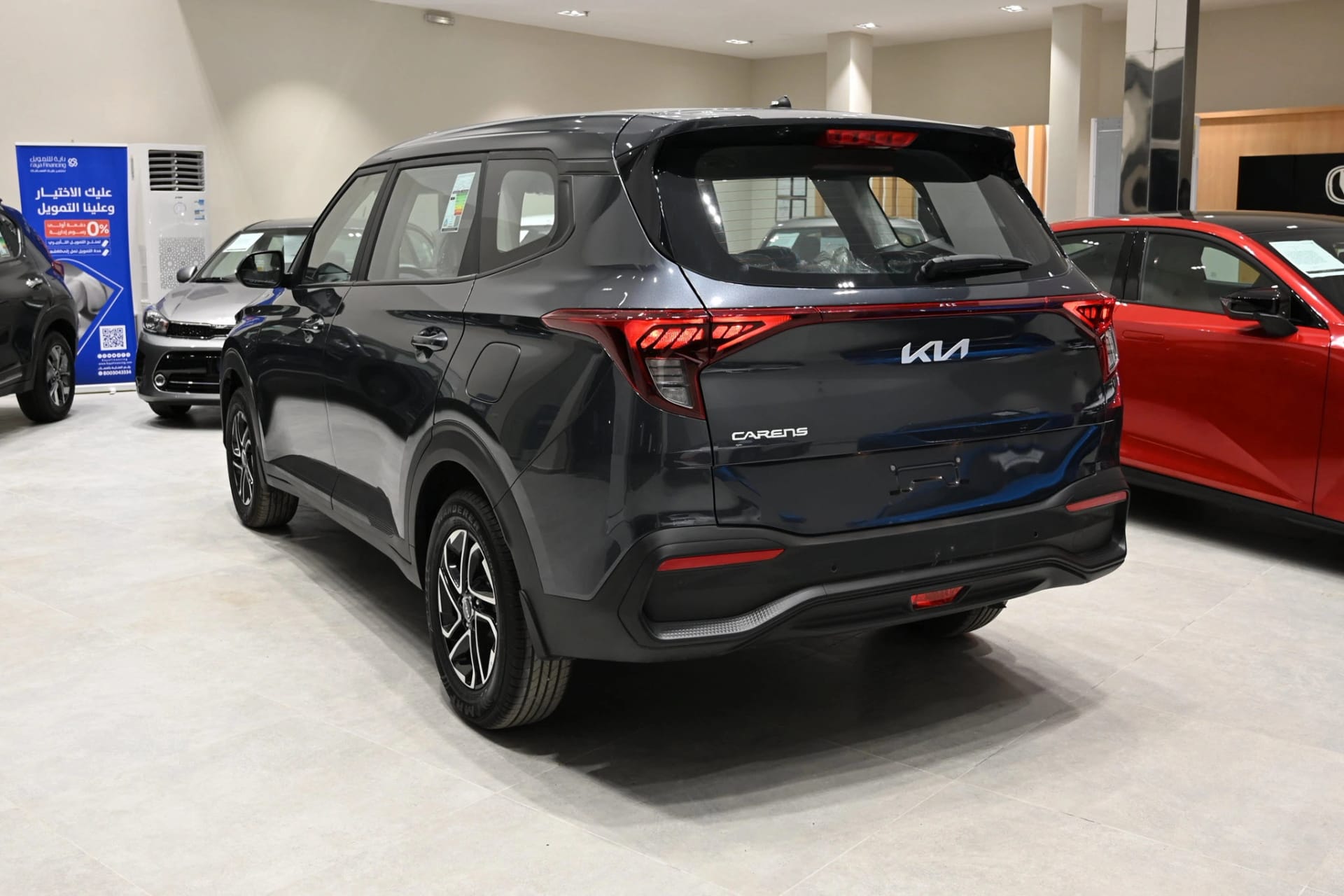Kia Carens rear back side view showing spacious boot and stylish MPV design for family travel