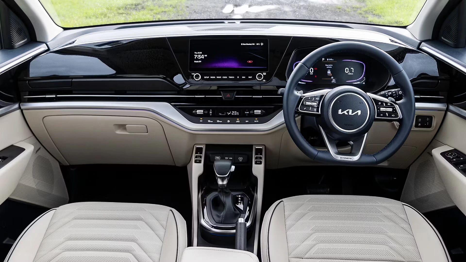 Kia Carens dashboard view with touchscreen infotainment and modern premium MPV interior design