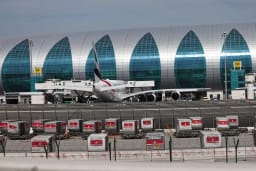 Dubai International Airport with limited foreign flight operations and parked aircraft amid travel restrictions